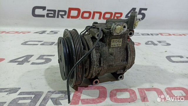 Компрессор кондиционера б/у для Kia Shuma (1204001