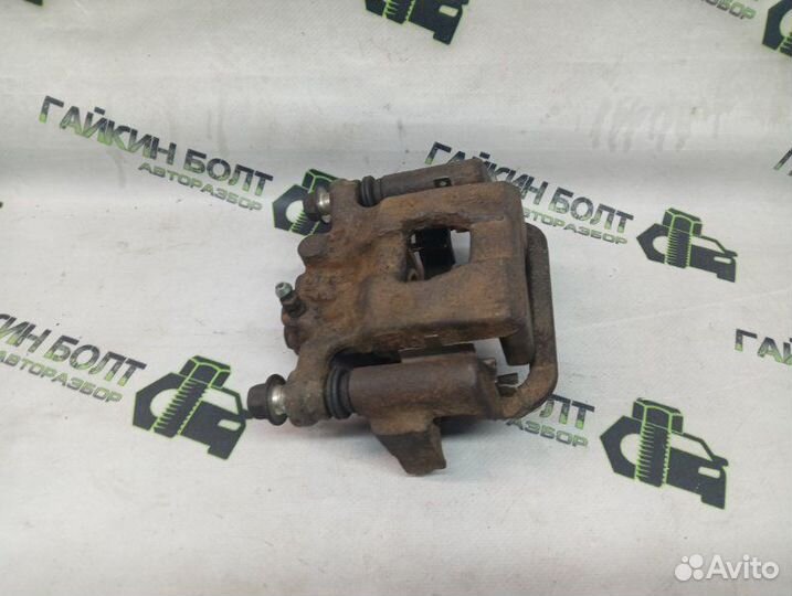 Суппорт тормозной задний правый Nissan Qashqai J10