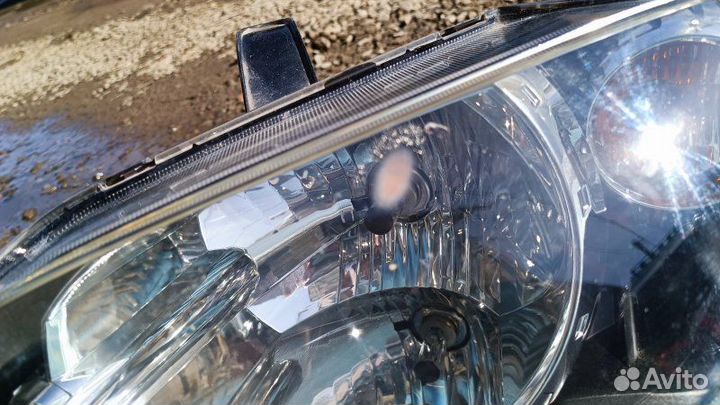 Фара левая Mazda Demio DY3W DY5W 2004