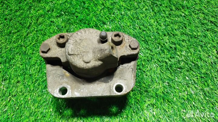 Тормозной суппорт правый передний Renault Logan