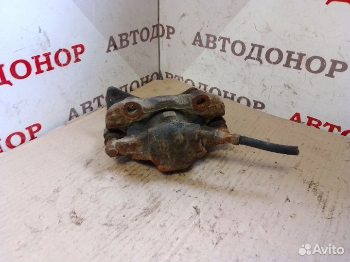 Суппорт тормозной передний левый Volkswagen Caddy