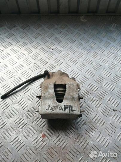 Суппорт тормозной передний левый Volkswagen Jetta