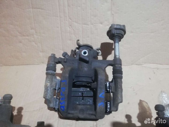 Суппорт тормозной Opel Astra J