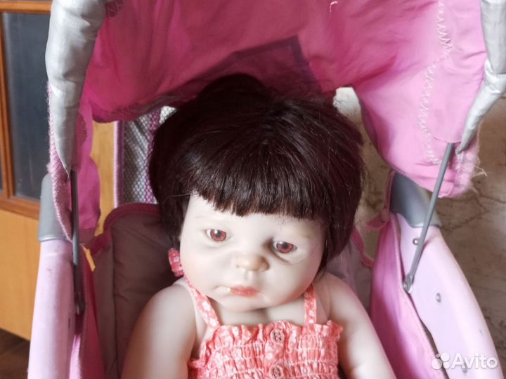 Кукла-реборн в коляске