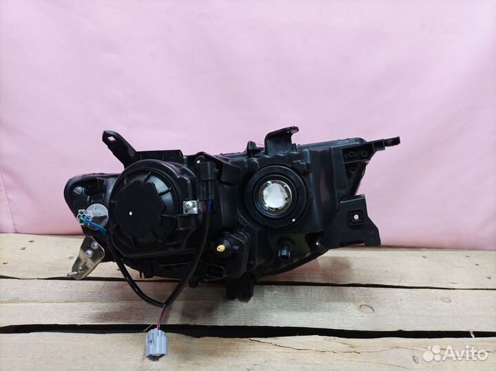 Фара левая Mitsubishi Pajero Sport 2 2008-2015