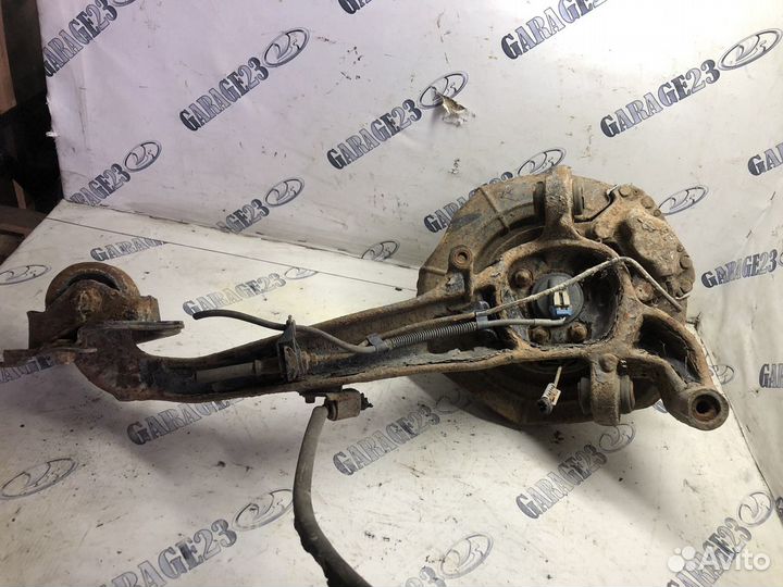 Задний продольный рычаг в сборе со ступицей правый