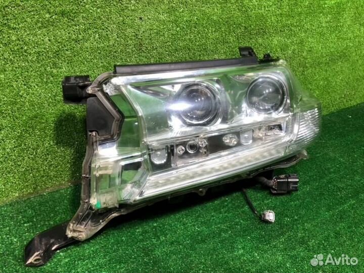 Фара левая Toyota Land Cruiser