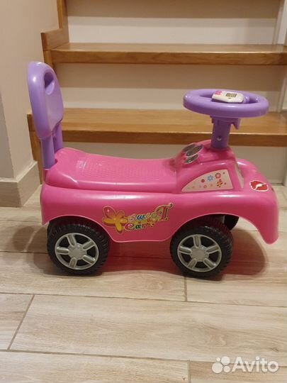 Машинка каталка толокар детская розовая музыкальна