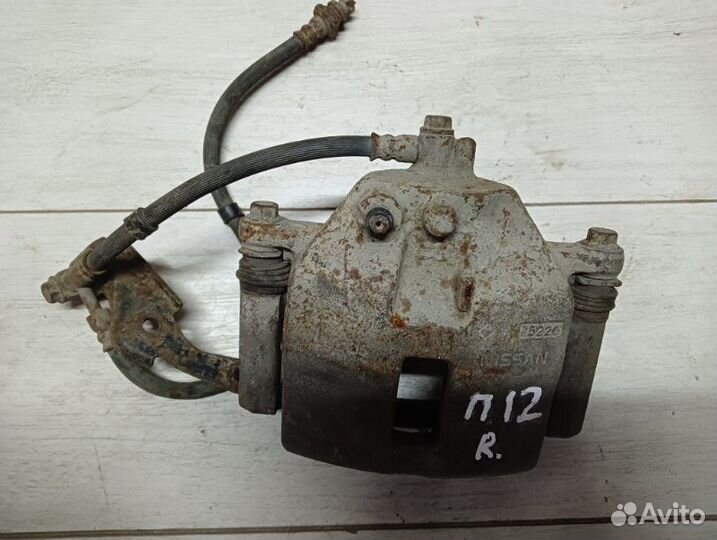 Суппорт тормозной передний правый Nissan Ниссан