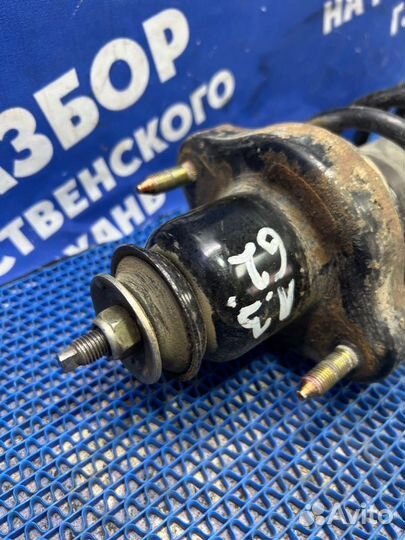 Задняя стойка амортизатора Mitsubishi Lancer 9