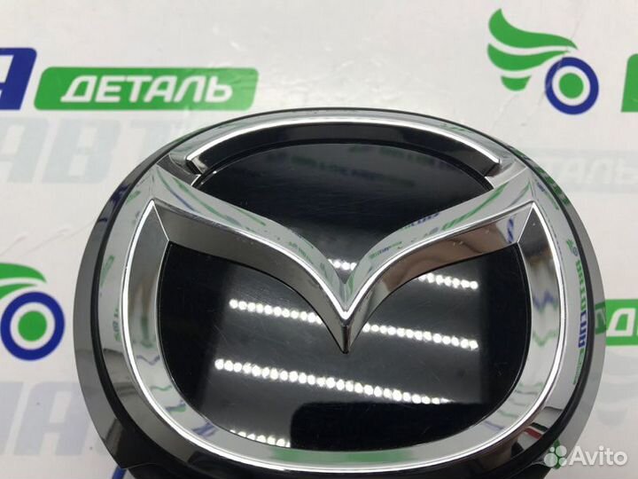 Эмблема крышки багажника Mazda 3Bp хетчбек 5D