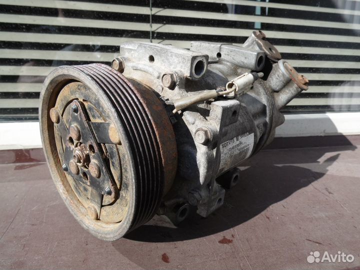 Компрессор кондиционера Рено Логан Сандеро