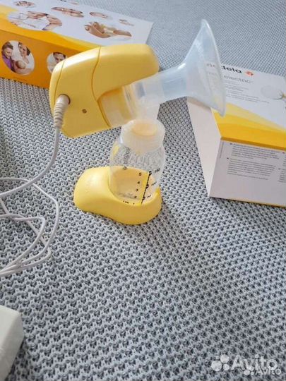 Молокоотсос medela электрический
