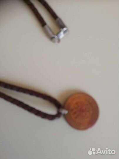 Монета медная 1912 года на кож. шнурке