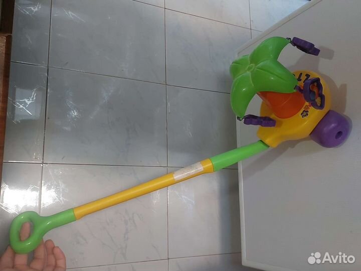 Каталка игрушка музыкальная