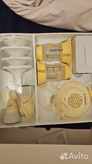 Молокоотсос medela swing maxi flex