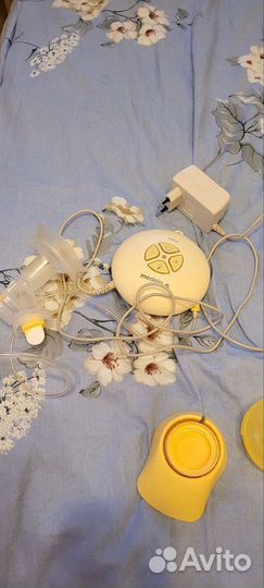 Молокоотсос medela электрический