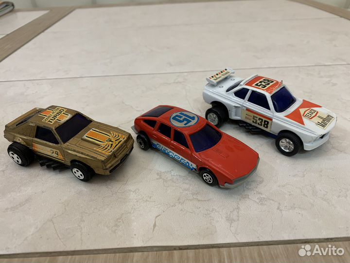 Машинки внедорожники с пружинным механизмом