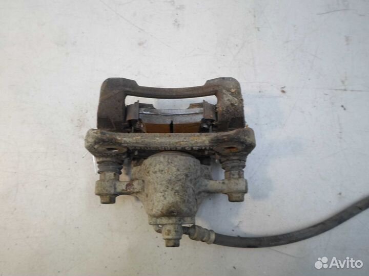 Суппорт задний левый Hyundai Tucson 2 LM