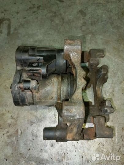 Суппорт тормозной задний левый Golf 7