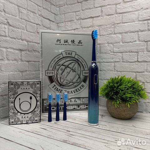 Электрическая зубная щетка