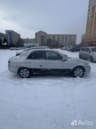 Mazda Familia 1.5 AT, 1999, 100 000 км