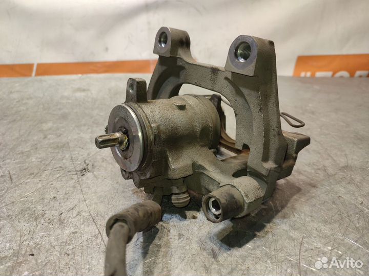 Суппорт тормозной задний левый Volkswagen Tiguan