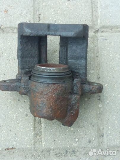 Суппорт тормозной передний Рено Логан 1