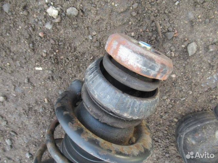 Стойка амортизатора передняя левая Mazda 121 3