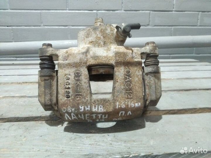 Суппорт тормозной передний левый Chevrolet Lacetti