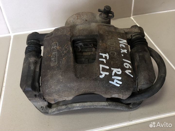 Суппорт тормозной левый R14 Daewoo Nexia