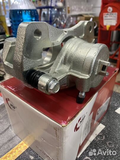 Суппорт тормозной передний Шевроле Лачетти