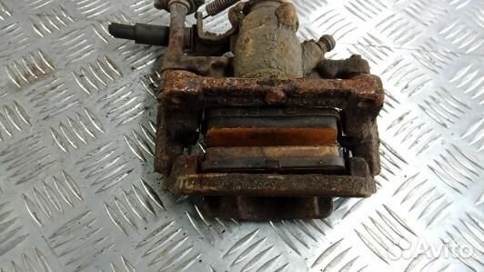 Суппорт тормозной задний левый opel astra J (NEA25