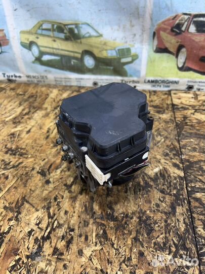 Блок ABS Мицубиси L200 4пок