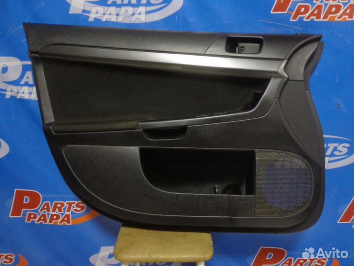 Обшивка двери передняя левая Mitsubishi Lancer 10