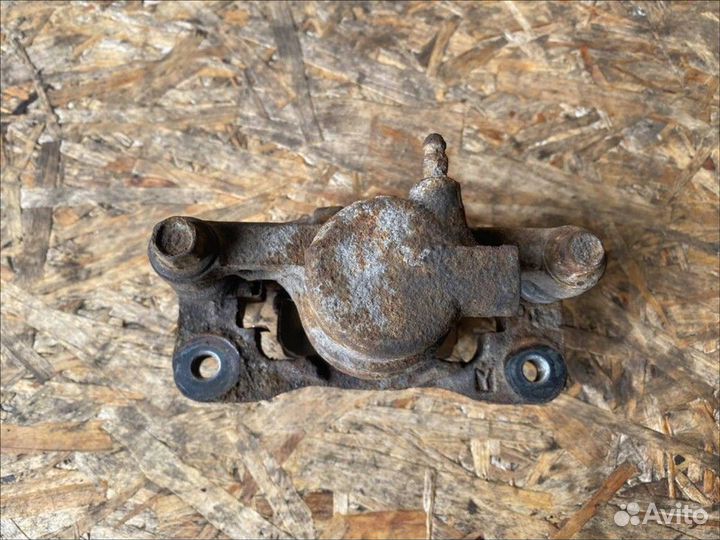 Суппорт задний левый Mitsubishi Lancer