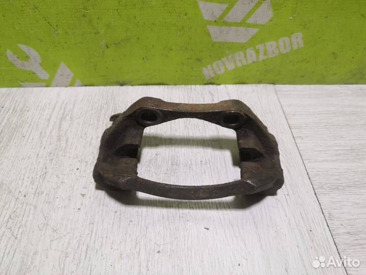 Скоба суппорта переднего Пежо 206