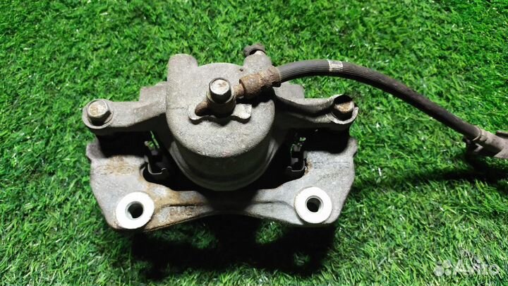 Суппорт тормозной передний левый Kia Cerato 2