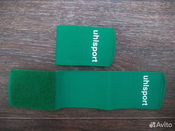 Держатели щитков Uhlsport