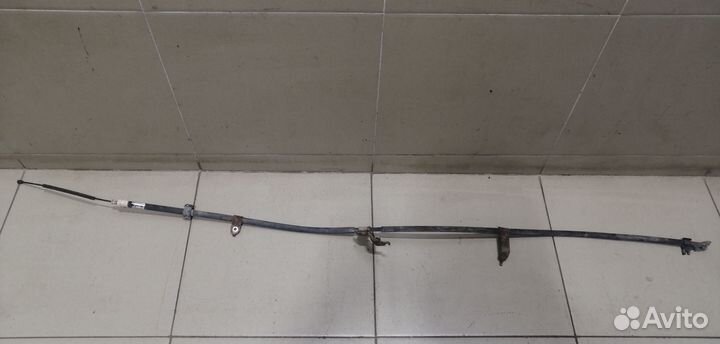 Трос стояночного тормоза левый Yaris 2005-2011