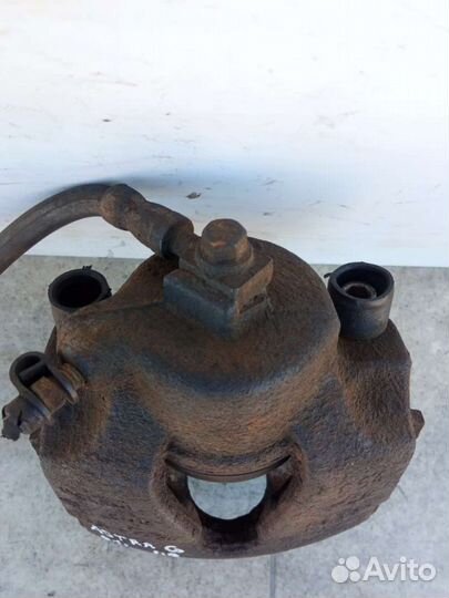 Суппорт тормозной передний правый Opel Astra G