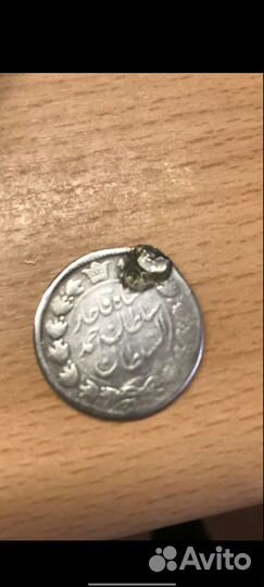 Монета 2000 динаров 1909 года Иран