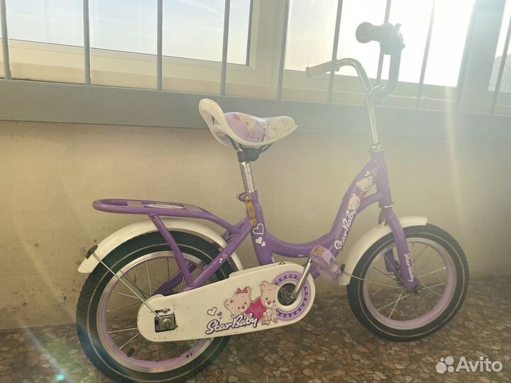 Велосипед для девочки четырехколесный