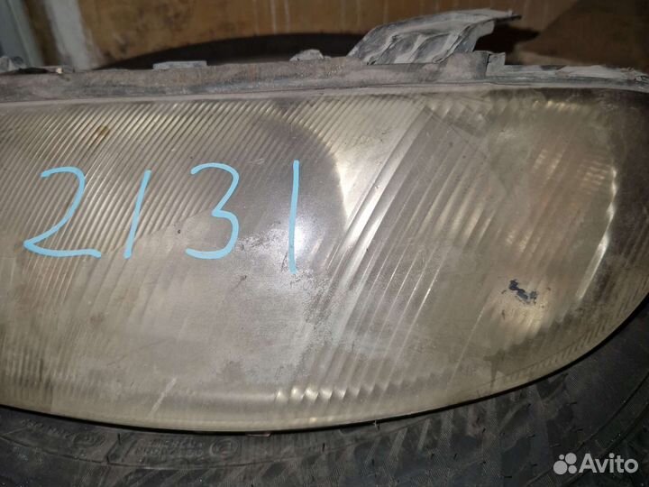 Фара Опель Омега Б левая hella