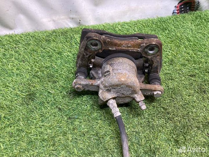 Суппорт тормозной передний левый Nissan Almera G15