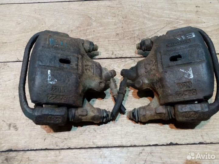 Суппорт тормозной передний Toyota Corolla E110