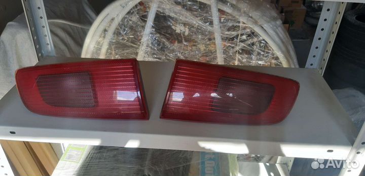 Задние фонари крышки багажника Мазда Демио