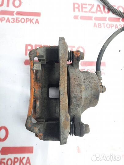 Суппорт тормозной передний левый Mitsubishi Galant