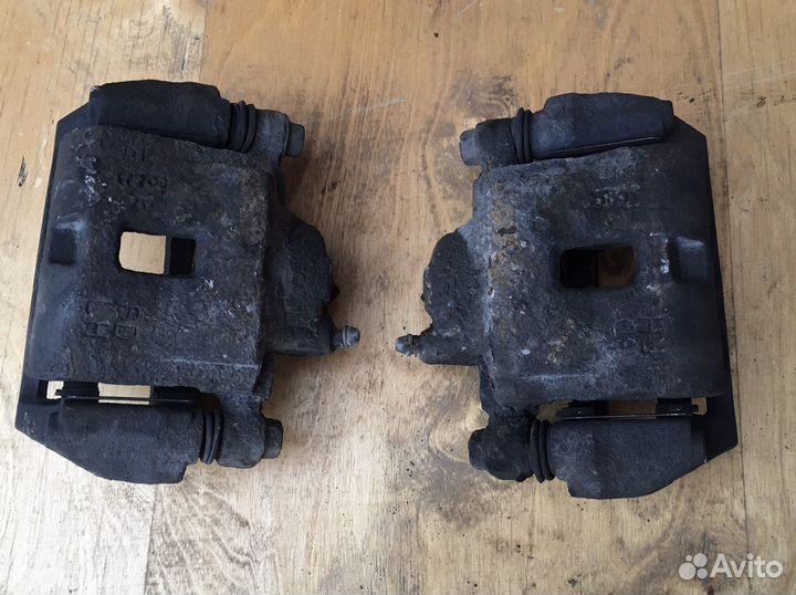 Суппорт тормозной передний Kia Spectra