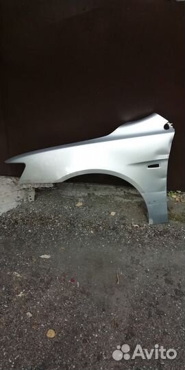 Переднее левое крыло lancer 10